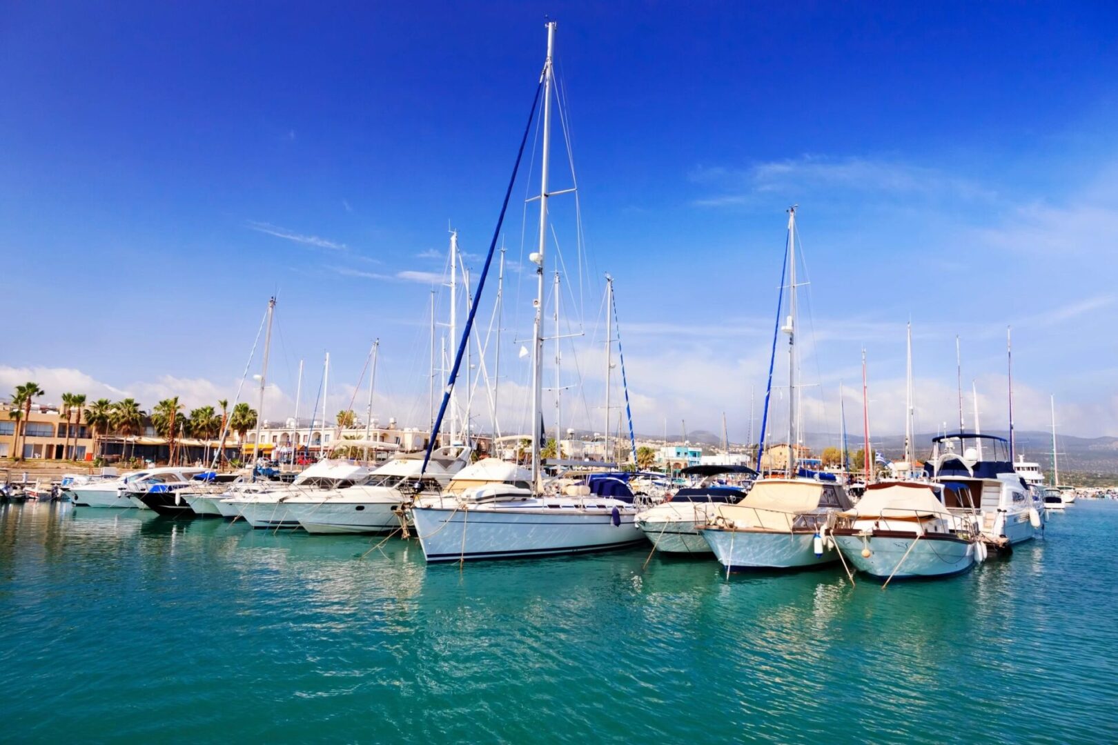 A group of boats in the water near each other.